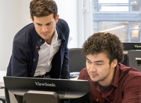 Teacher helping student